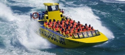 Yellow Jet Boat With A Group On Board