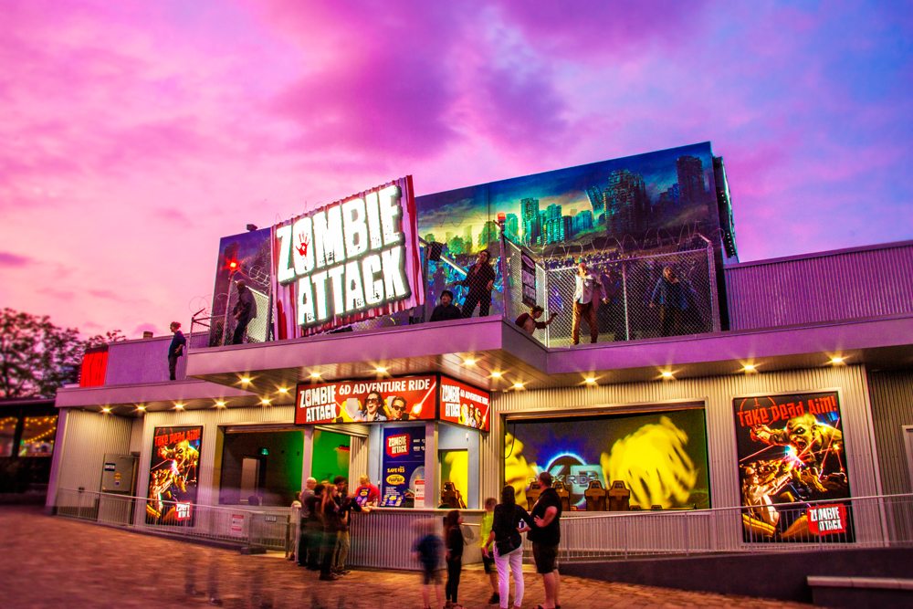 Zombie Attack entrance at night with beautiful pink sunset.