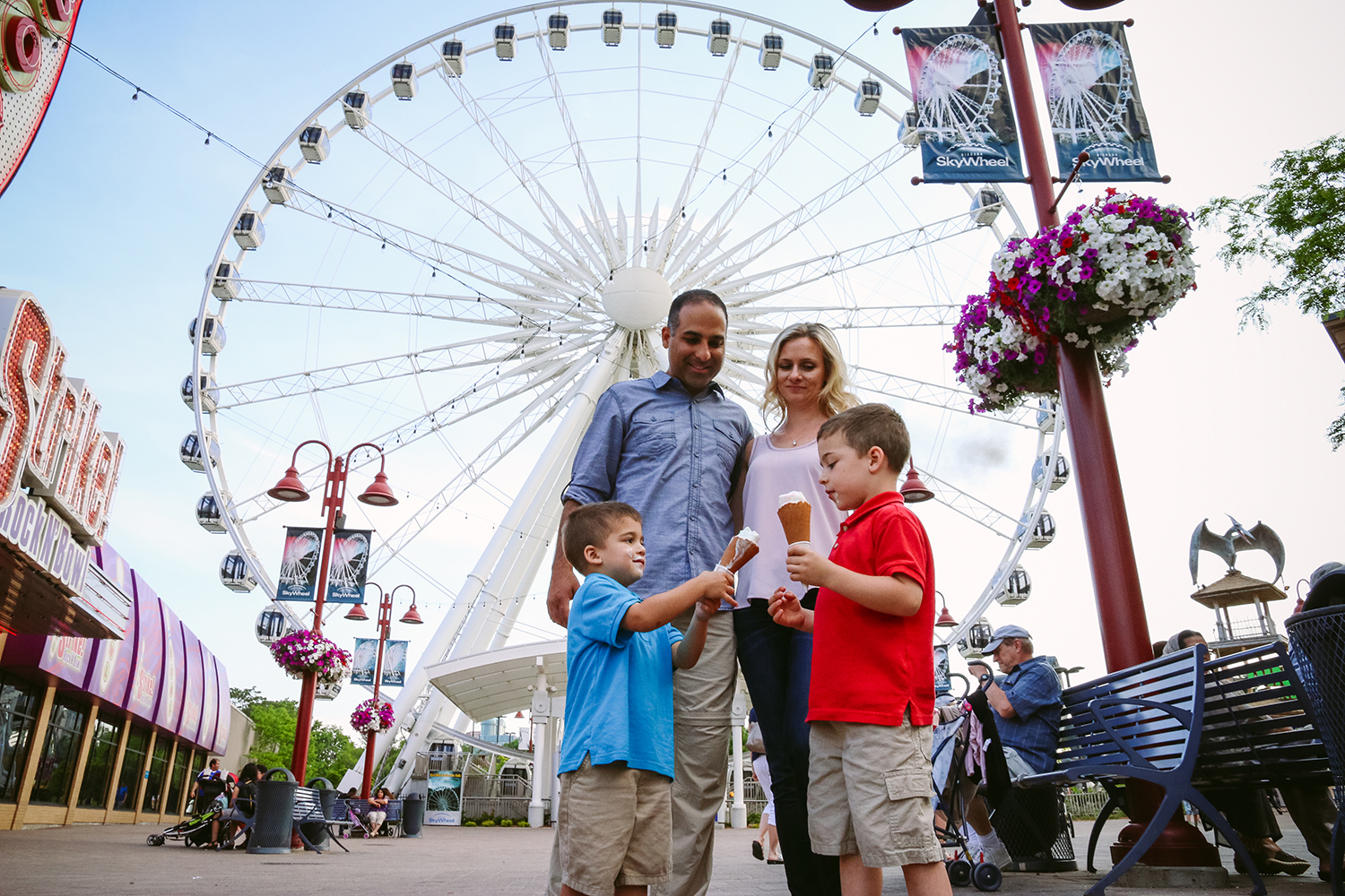 Family enjoying ice cream On Clifton Hill in front of SkyWheel