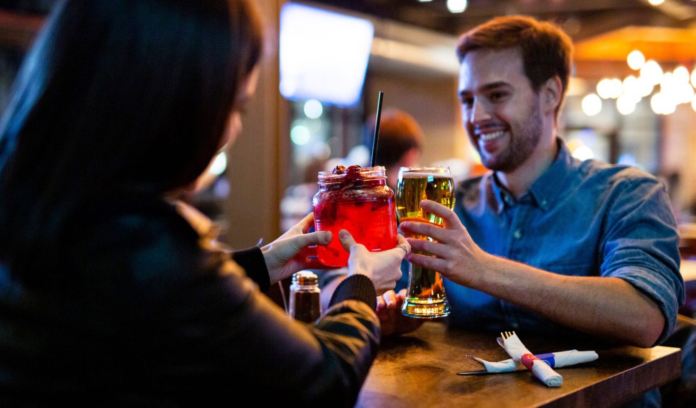 Couple enjoying a casual dinner date at Kelsey's on Clifton Hill