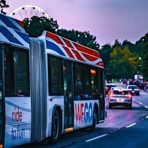 Wego Bus at Night on the Niagara Parkway with SkyWheel in background