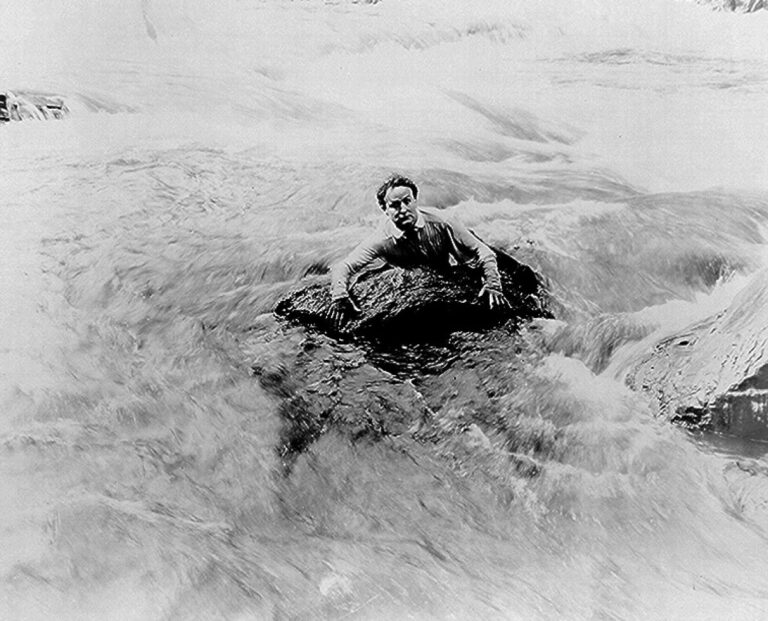 Houdini swims river in scene from The man from beyond