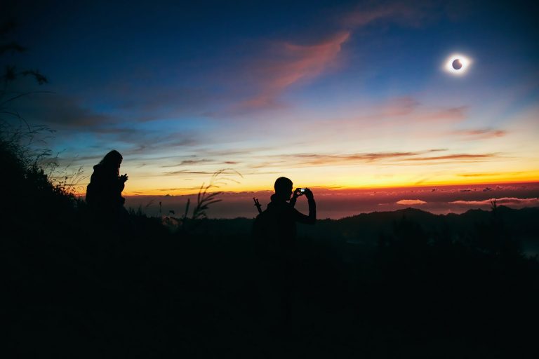 Solar eclipse on a colorful sky