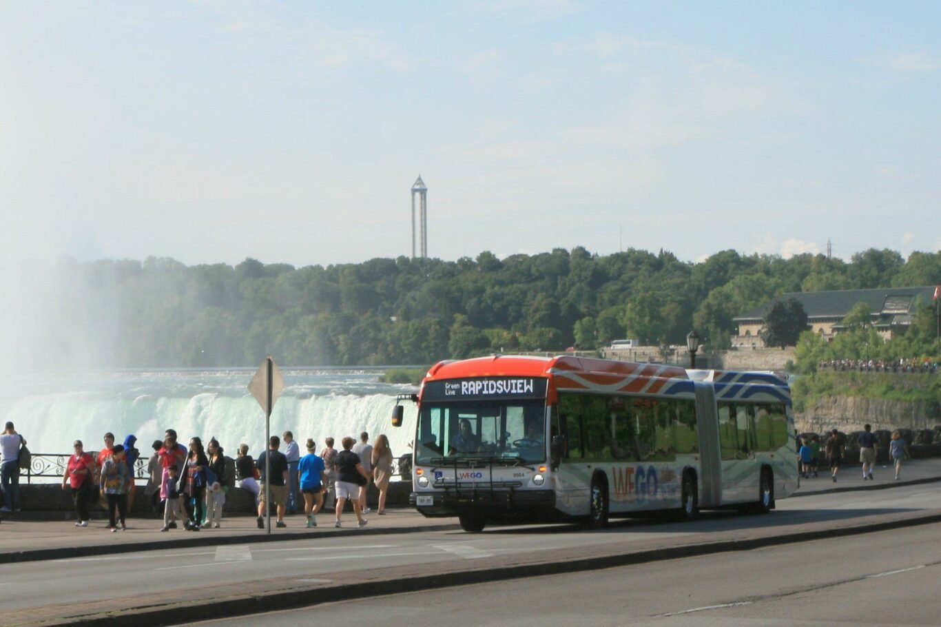 Wego Bus at Daytime on the Niagara Parkway with Falls in background