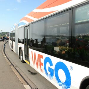 Wego Bus at Daytime on the Niagara Parkway with Falls in background