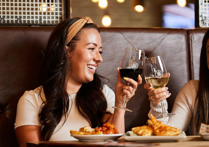 Kelsey's Restaurant with two Ladies eating and drinking