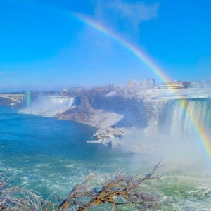 Mesmerizing view of beautiful winter landscape, rainbow over the Horseshoe Falls in Niagara Falls