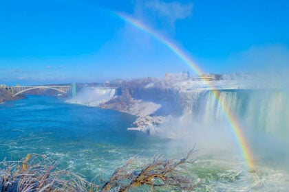 Mesmerizing view of beautiful winter landscape, rainbow over the Horseshoe Falls in Niagara Falls