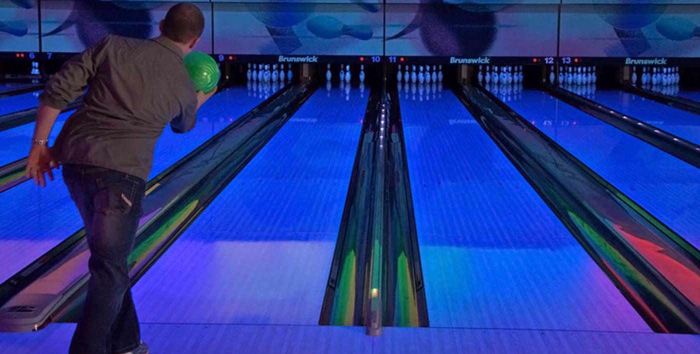 Gentleman cuing up bowling ball
