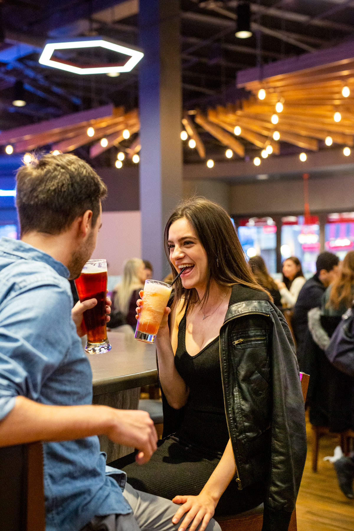 Couple enjoying drinks at boston pizza bar