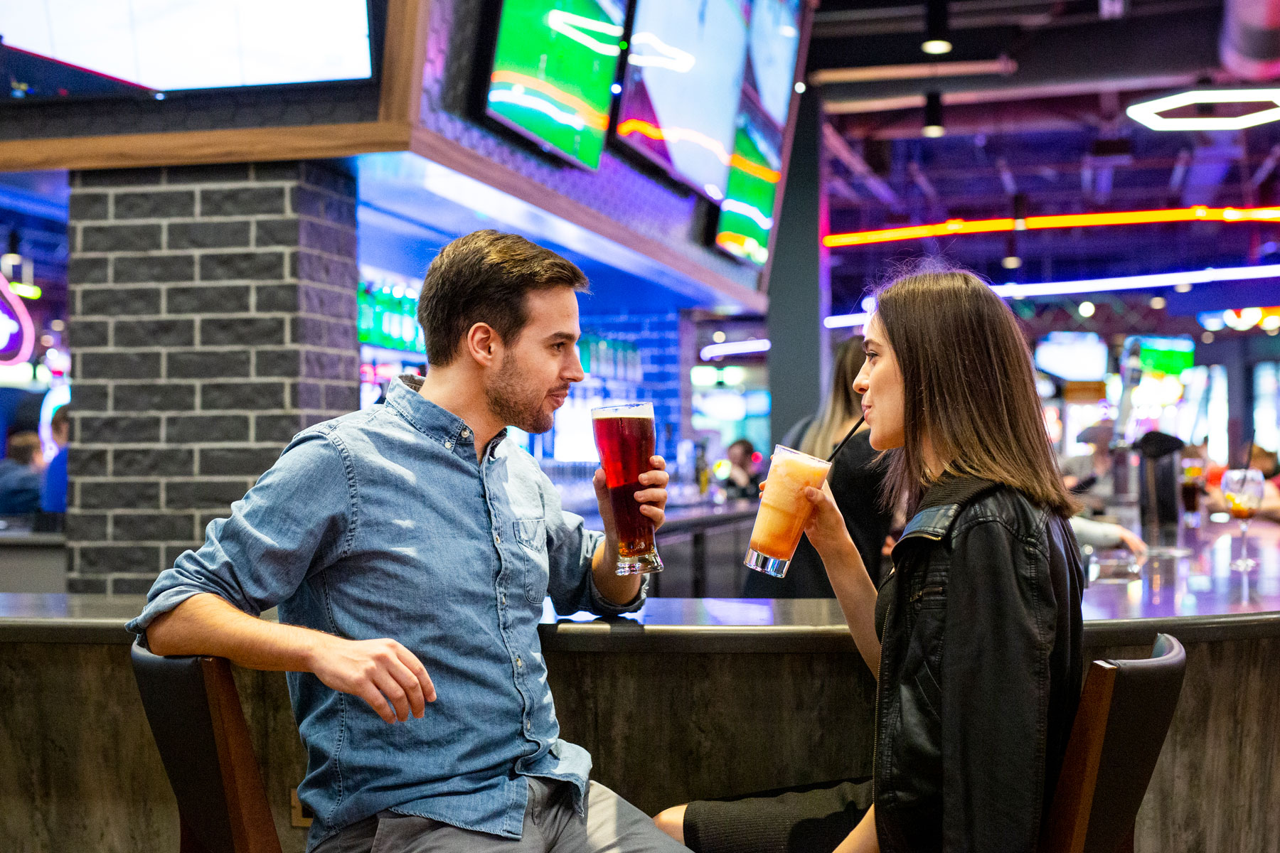 Couple enjoying drinks at boston pizza bar