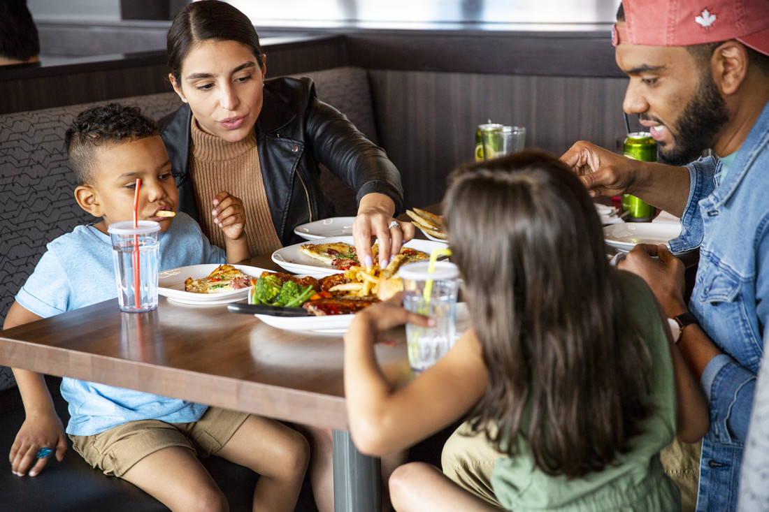 Booth Close up of family dining at Boston Pizza Clifton Hill