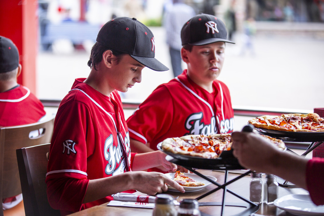 Boston Pizza Sports Team eating pizza