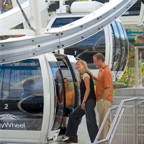 Skywheel Photo With Family Loading into Gondola