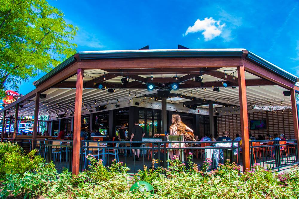Kelsey's Patio Guitarist Entertaining Guests