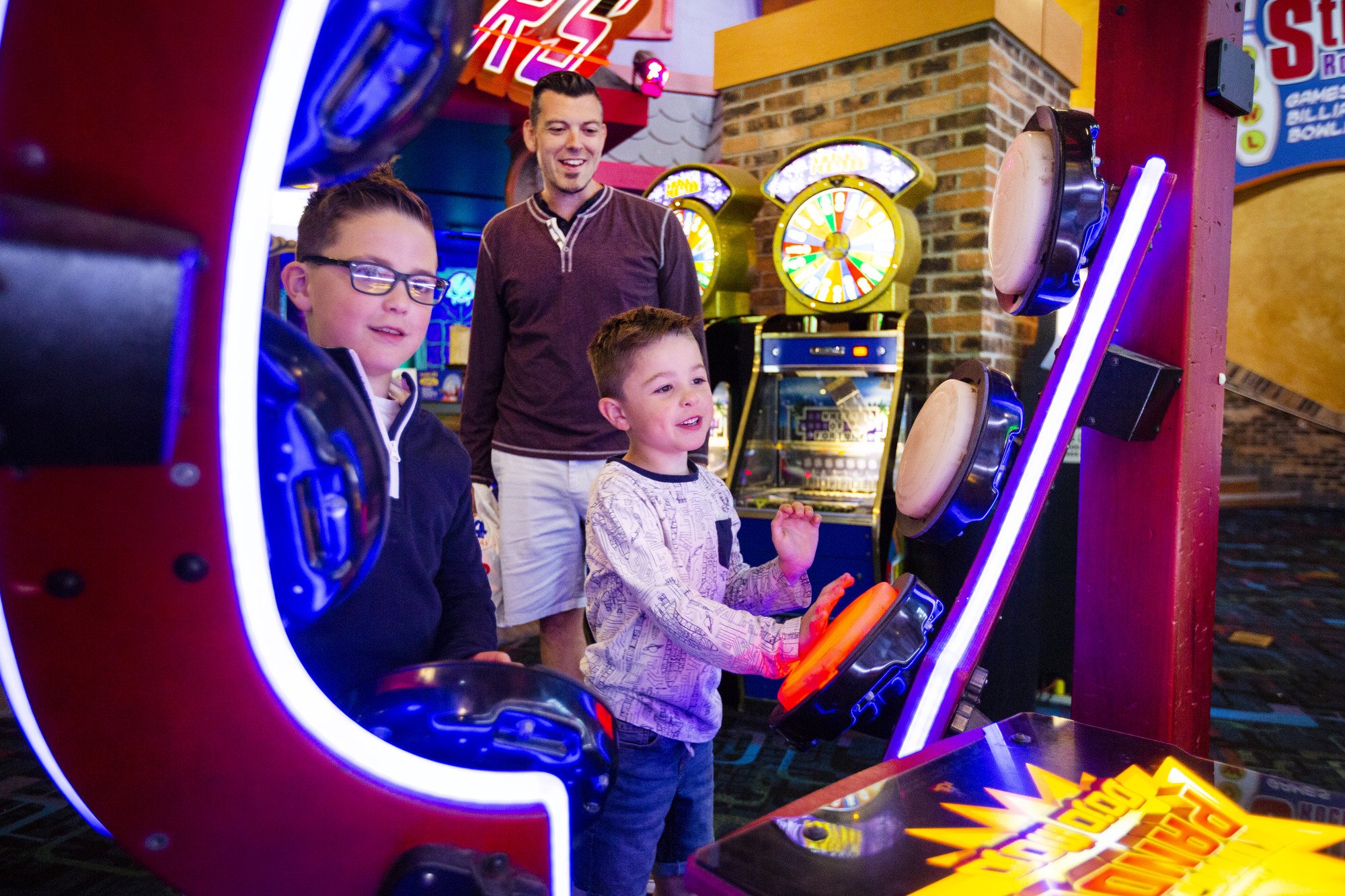 Family enjoying space ride with two excited boys