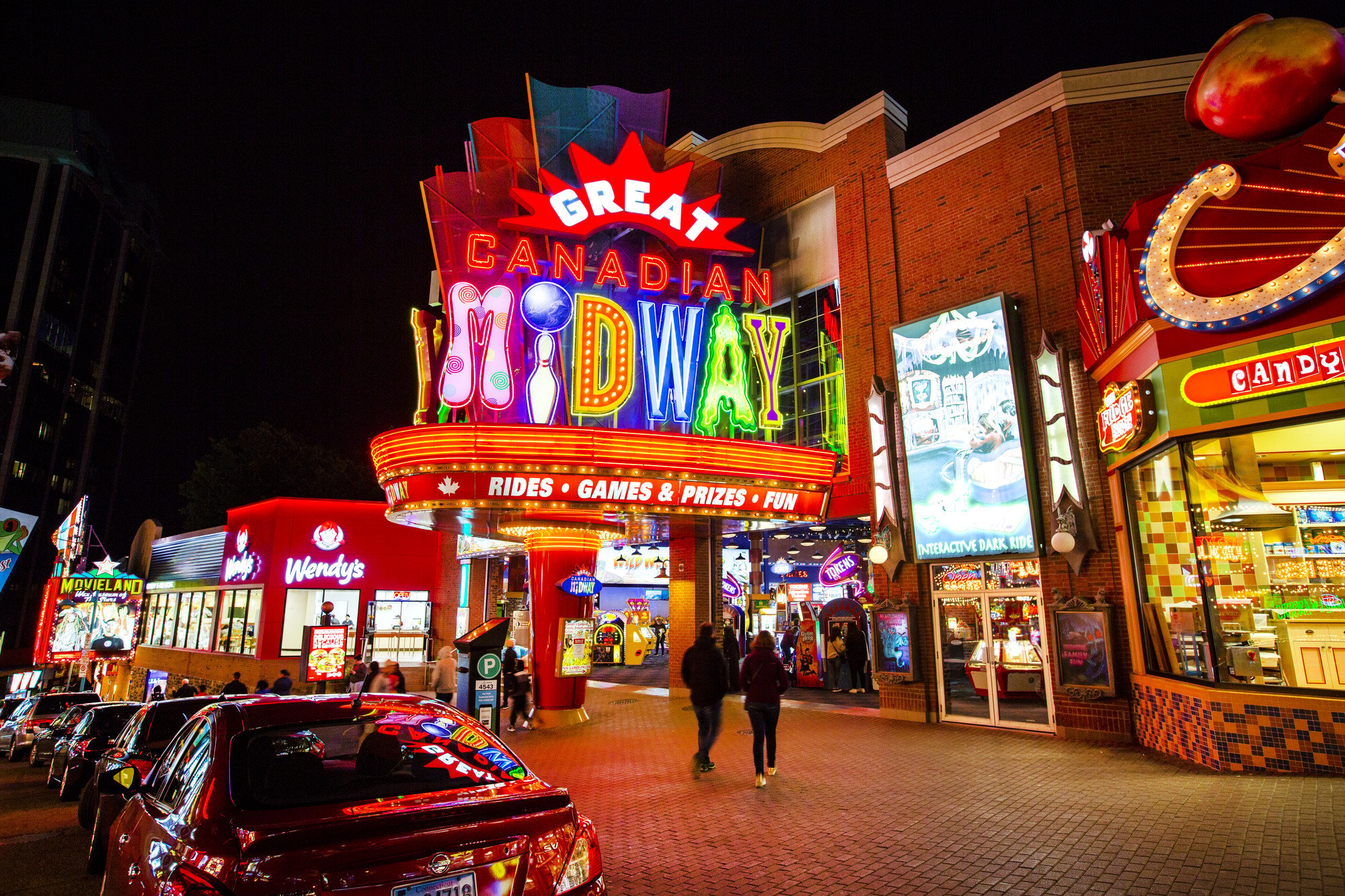 Midway at night all lit up in neon