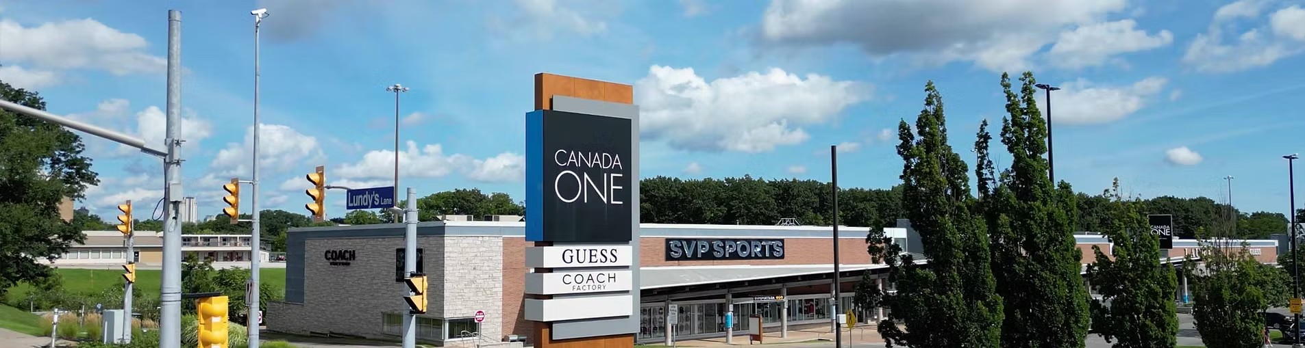 Canada One Outlet on Lundys Lane featuring SVP, COACH, and Guess