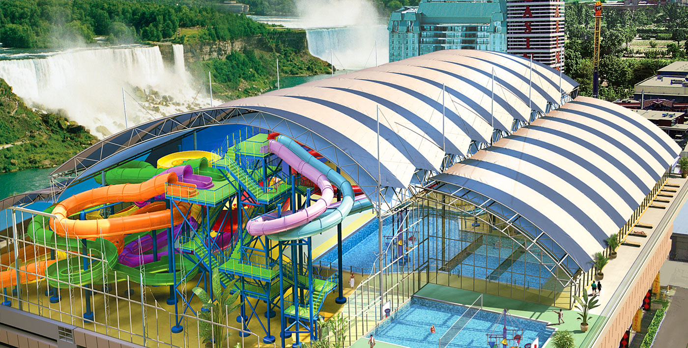 Fallsview Indoor Waterpark Exterior showcasing multiple coloured slides with the Falls and Casino in the background