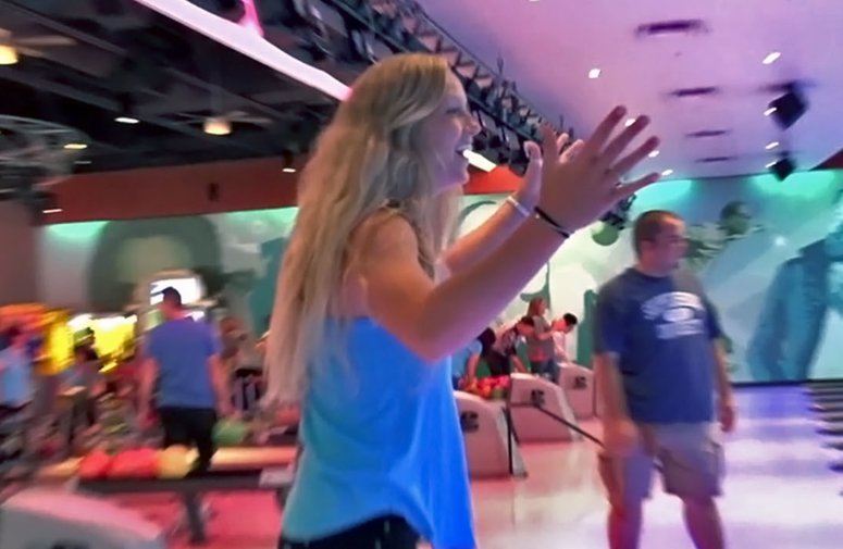 BP Bowling with Young Lady Celebrating Strike