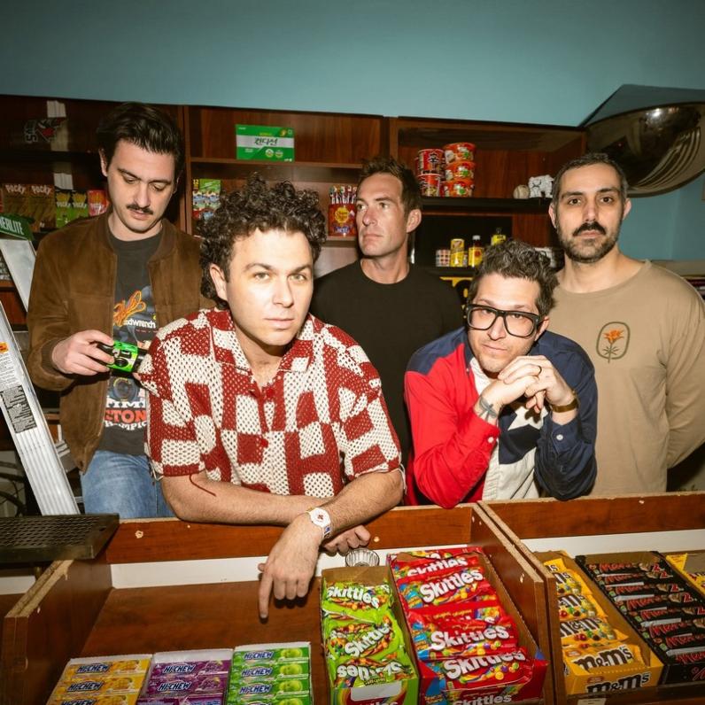 Arkell band members inside a candy shop