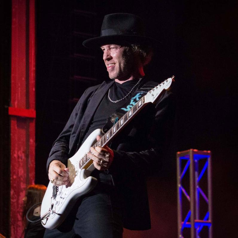 Kenny Shepherd playing guitar