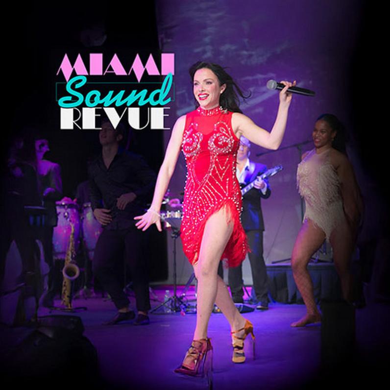 Lady in red dress walking in heels with a microphone in her hand