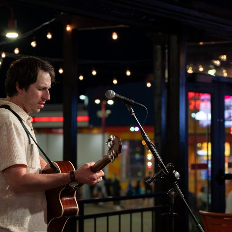 Matt Taylor live on Kelseys Patio with Speedway in the background
