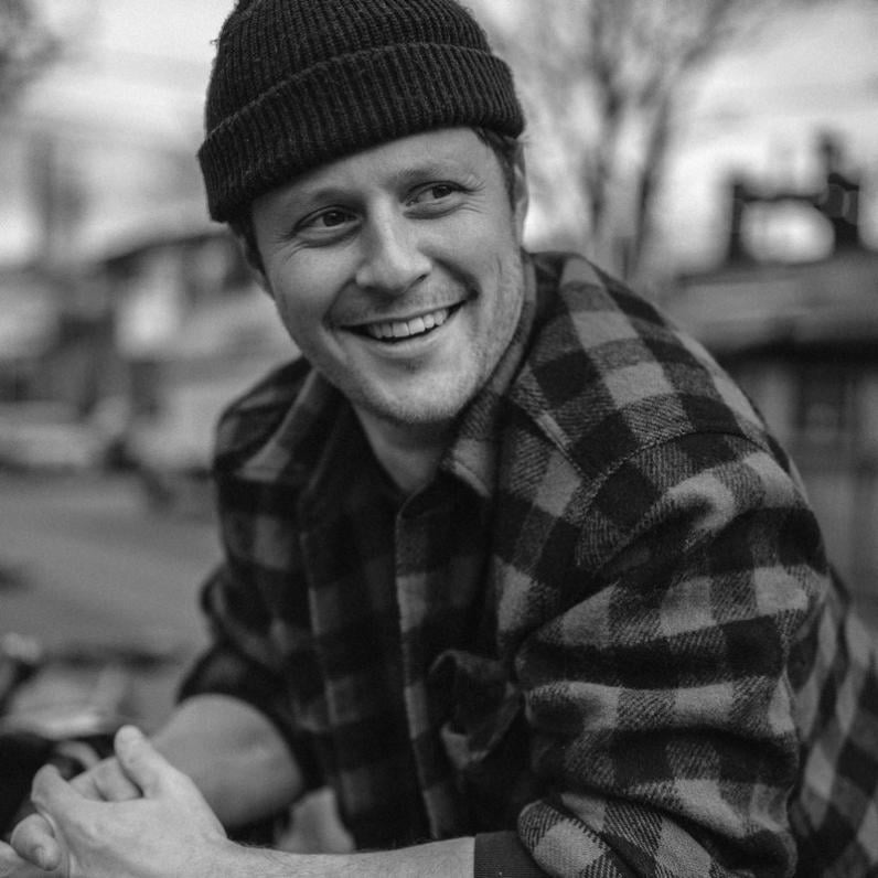 Noah wearing a toque and a plaid shirt