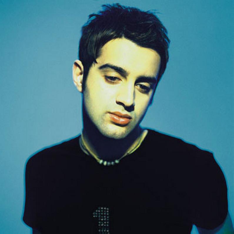 headshot of paul gigliotti with blue background