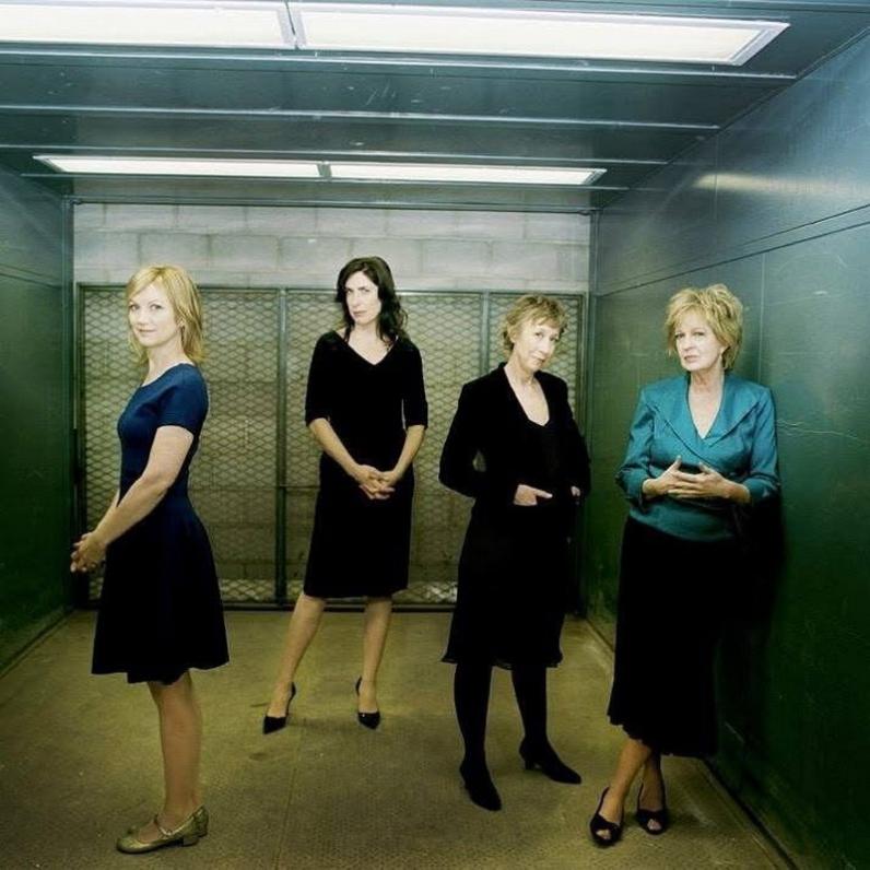 Four women standing