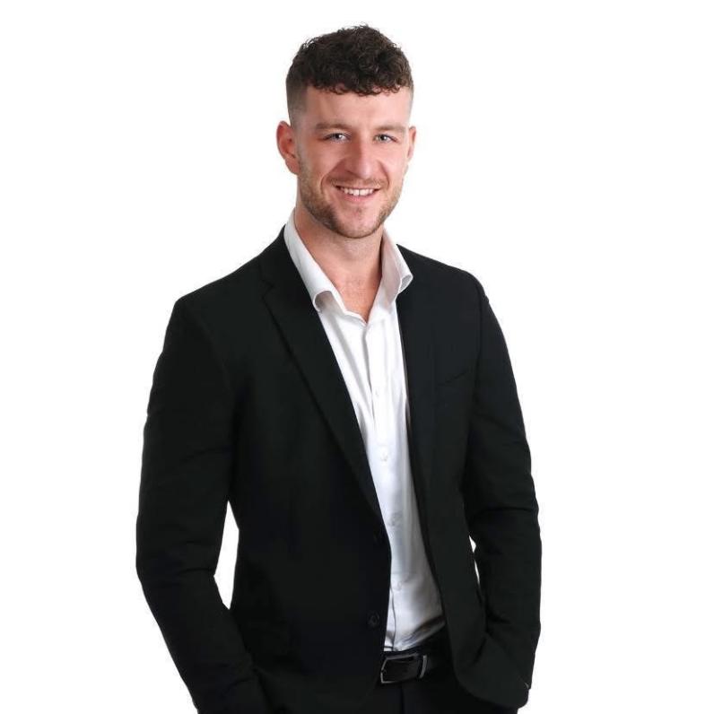 Ben Albert in a black and white suit