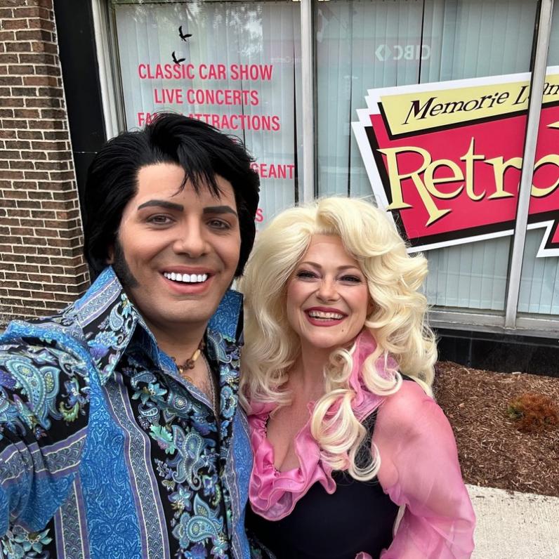 Elvis & Dolly tributes taking a selfie outside of a diner