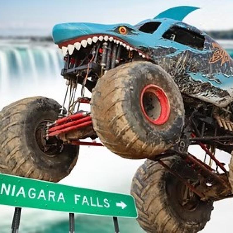 Sharky Monster Truck mid air with the falls in the background