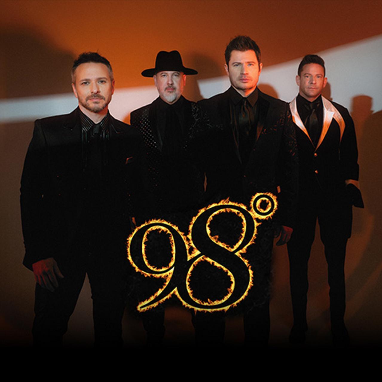 Band stands with the 98 degree logo in front