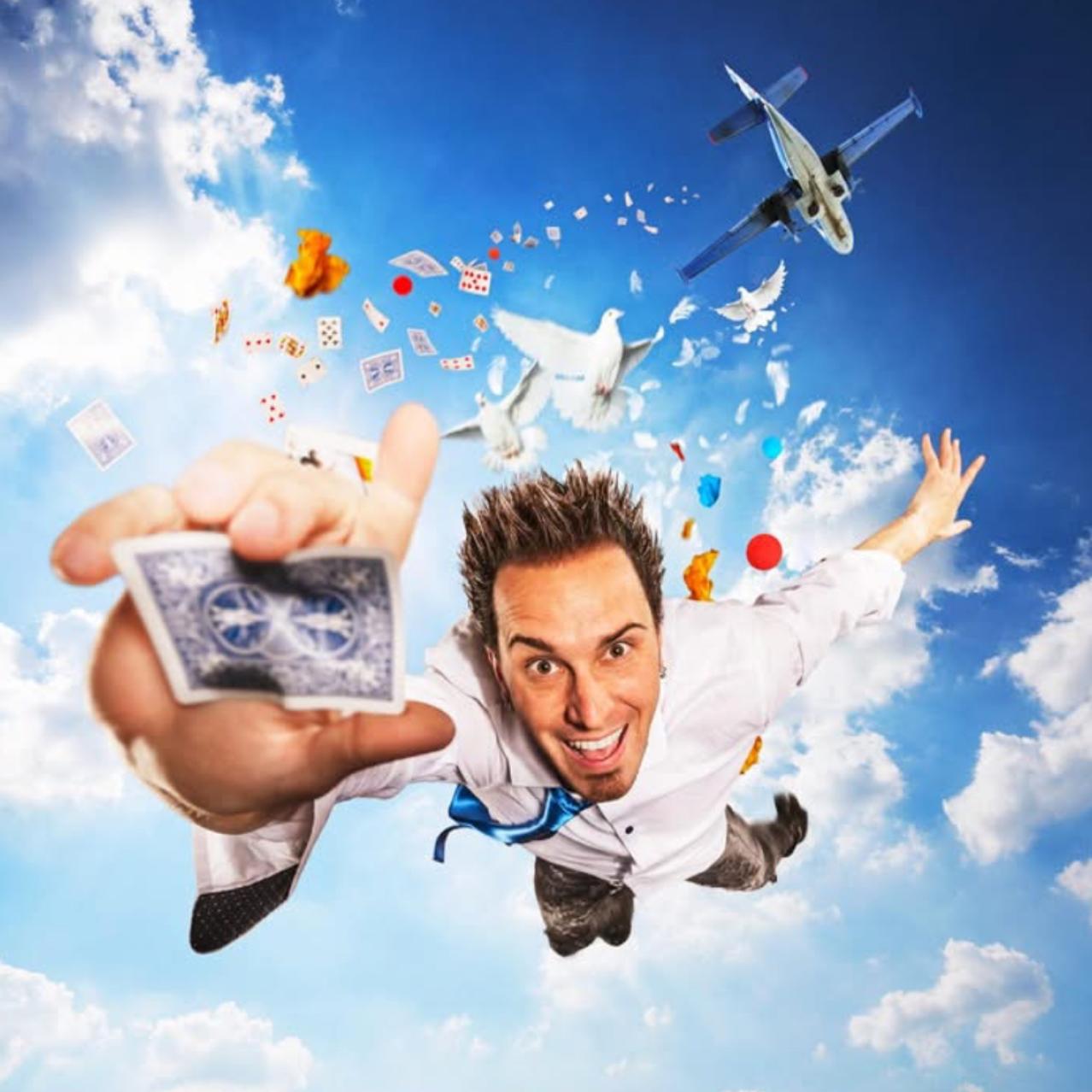 David DaVinci dropping from an airplane with a blue clouded sky holding a playing card in his hand