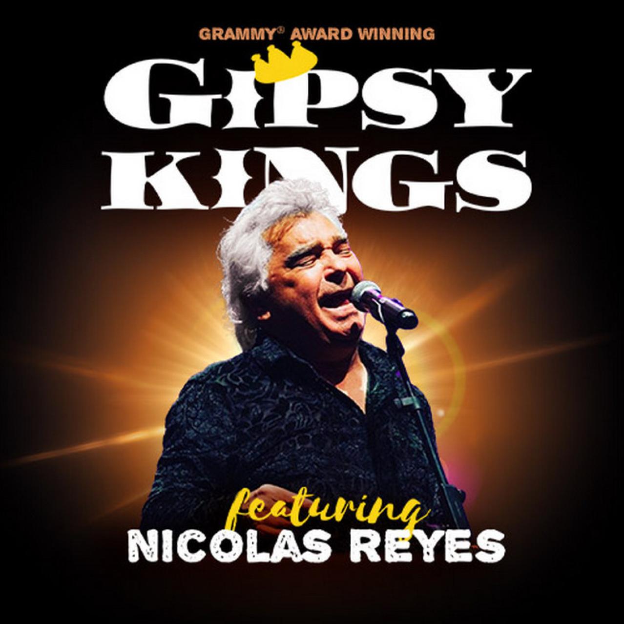 Nicolas Reyes singing into a microphone