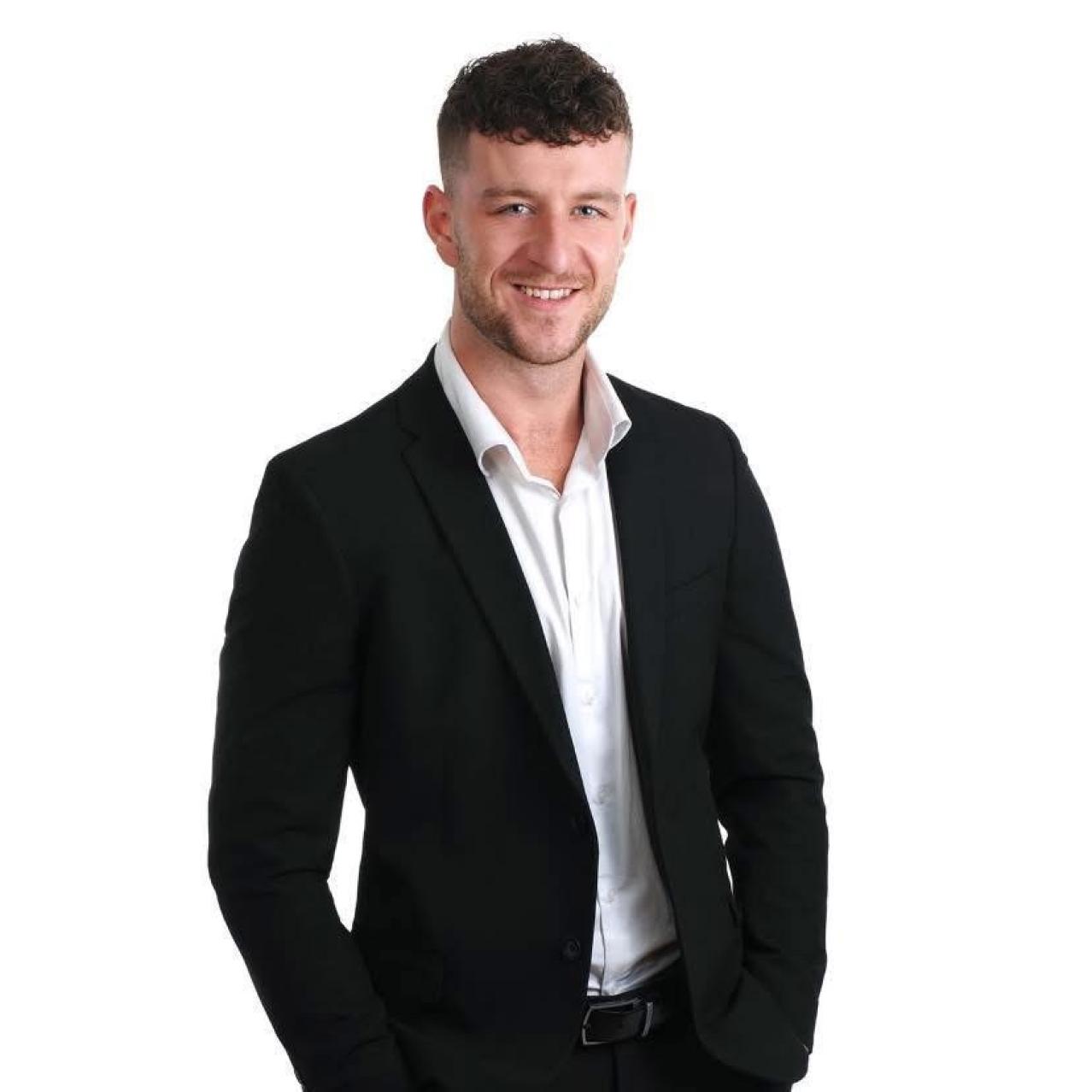 Ben Albert in a black and white suit