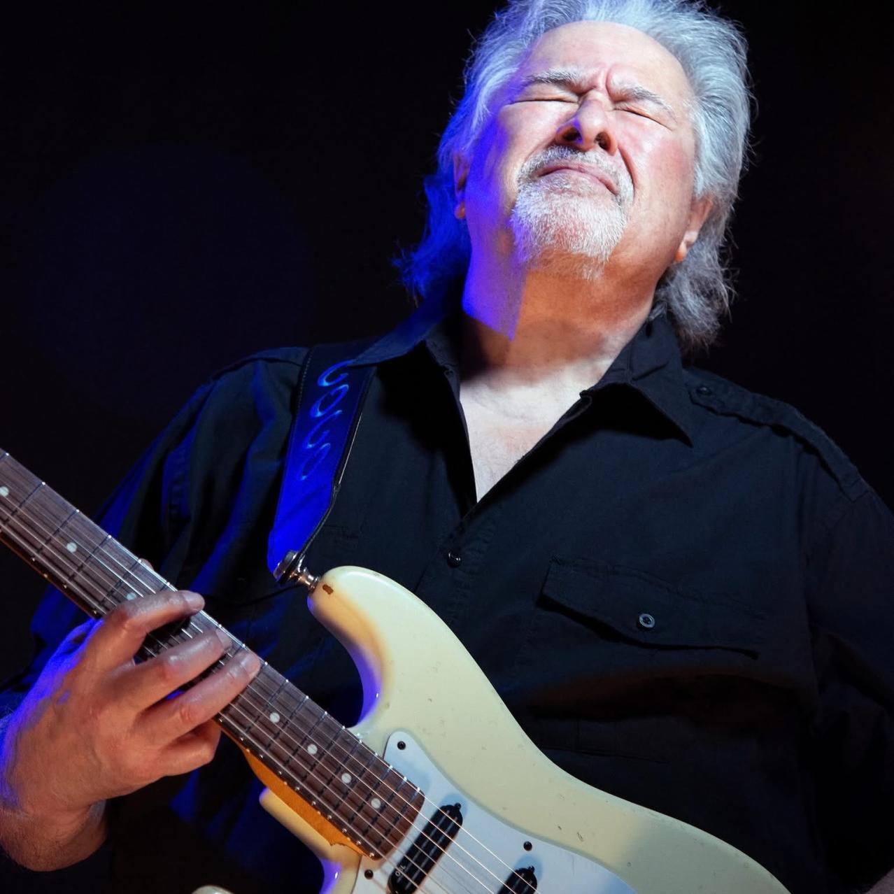 Coco Montoya playing guitar