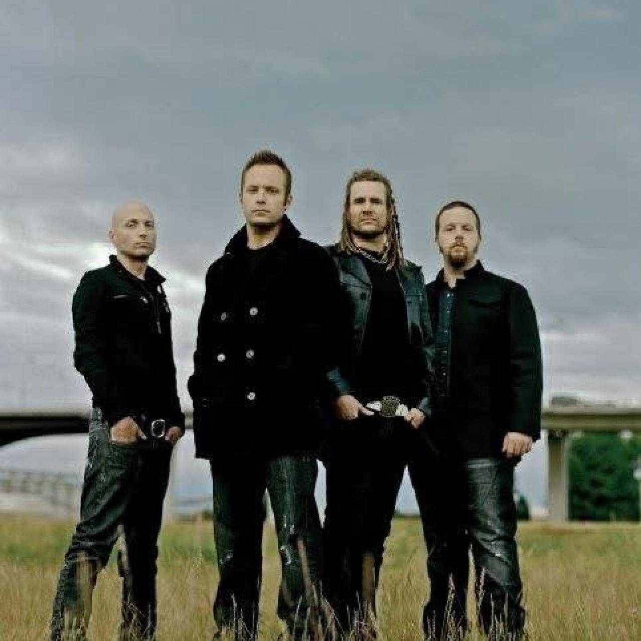 Default band members standing in a field