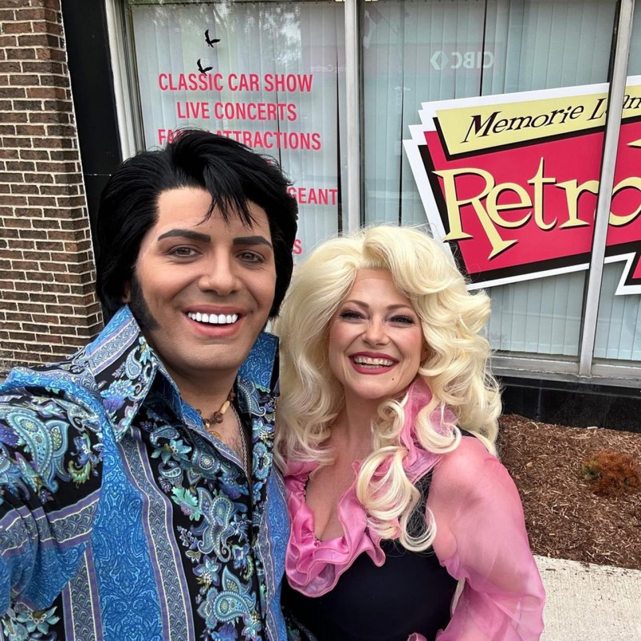 Elvis & Dolly tributes taking a selfie outside of a diner
