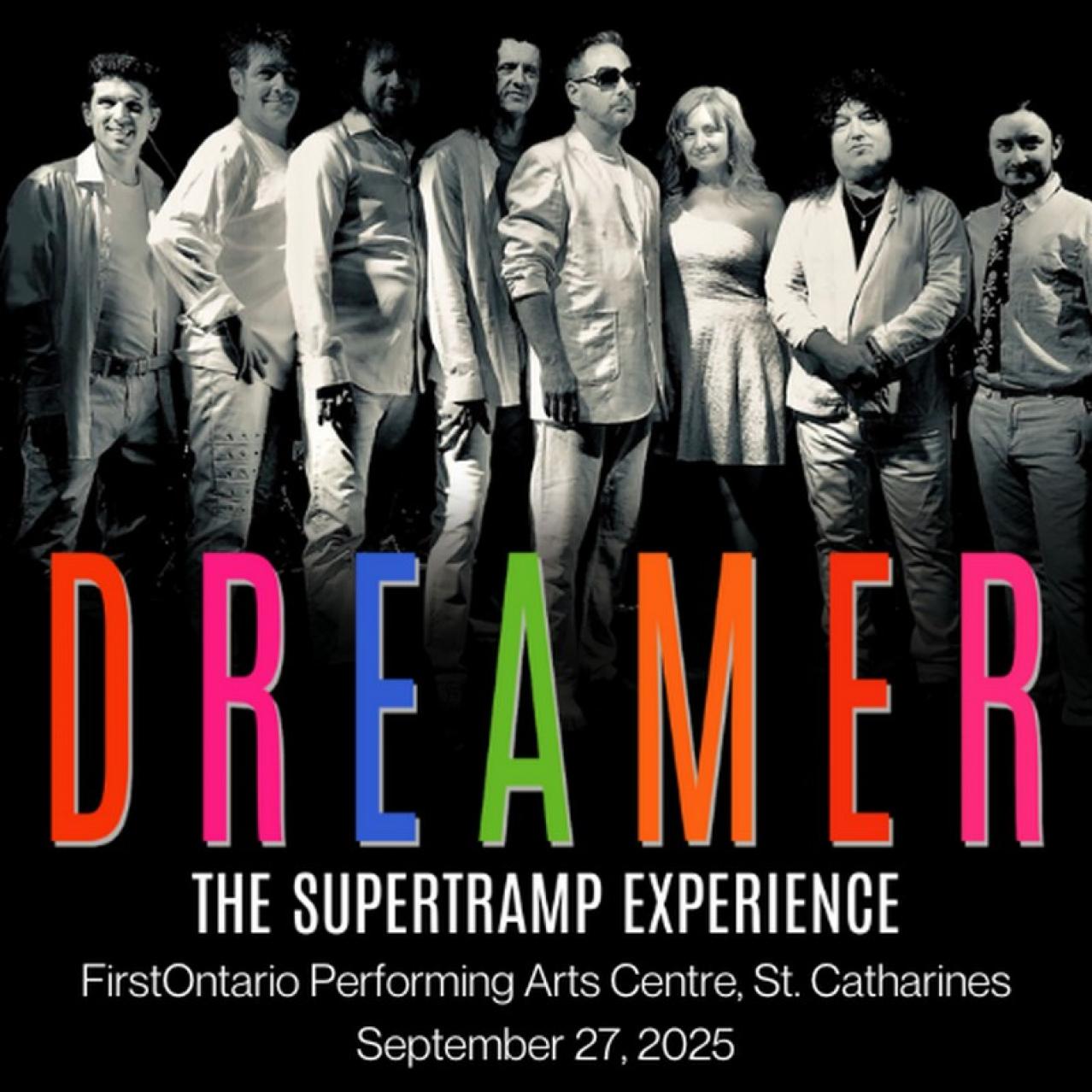 Dreamer in rainbow colours, bandmembers in background grey
