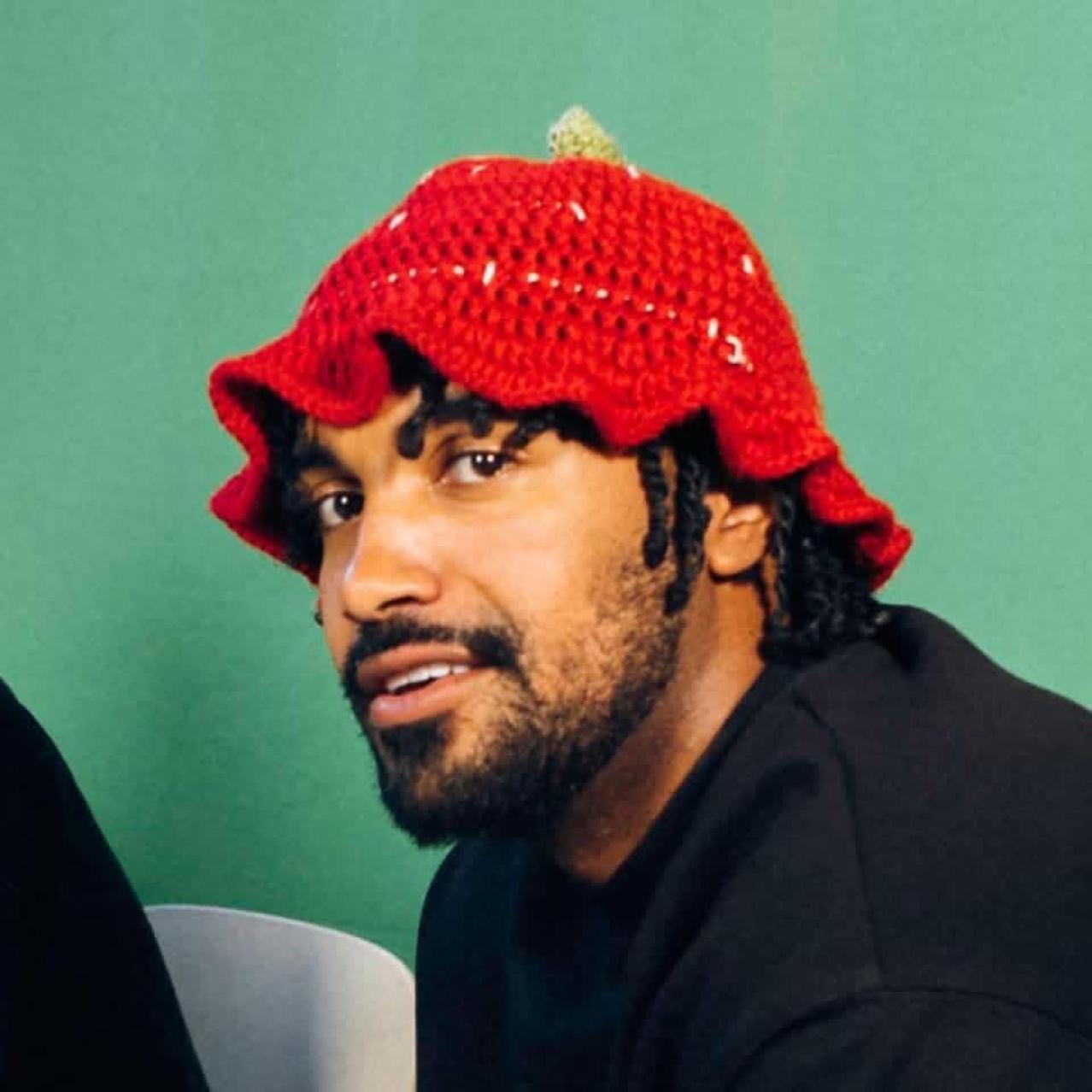 Hassan Phills in a knitted red hat