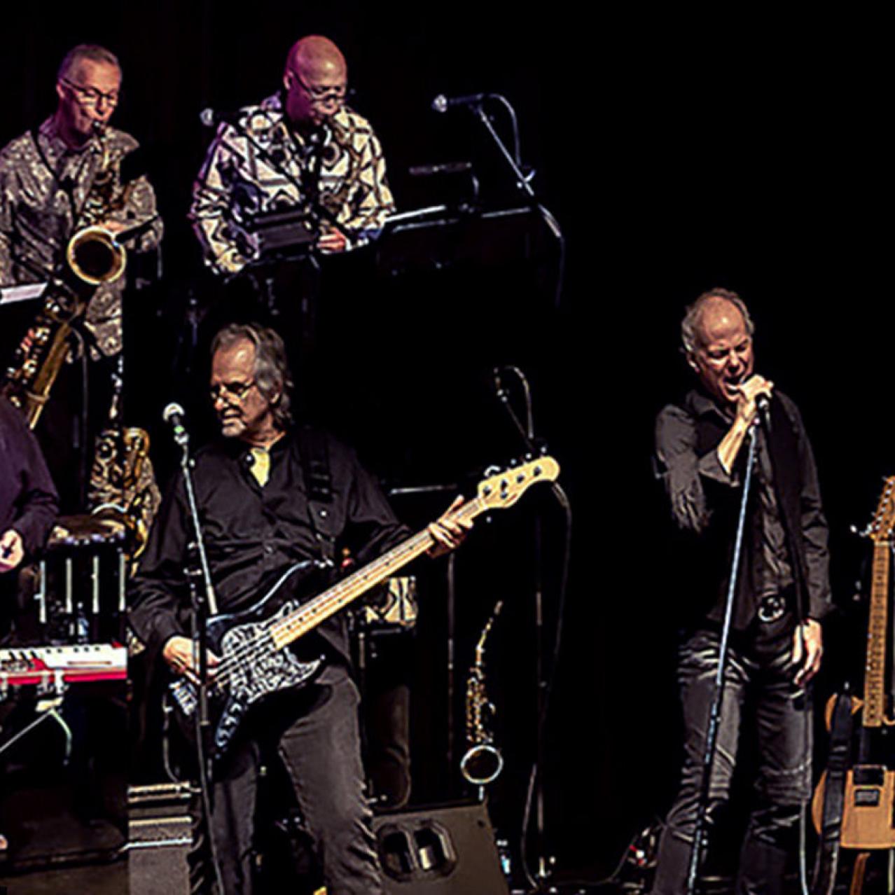 Lighthouse band members on stage