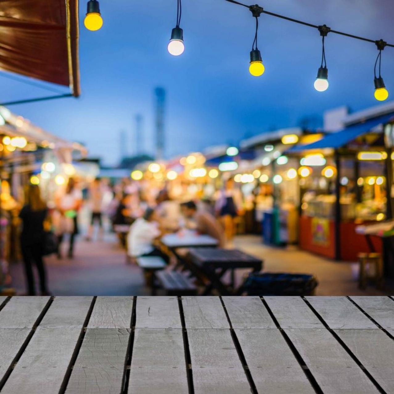 Table with lights and people in the background