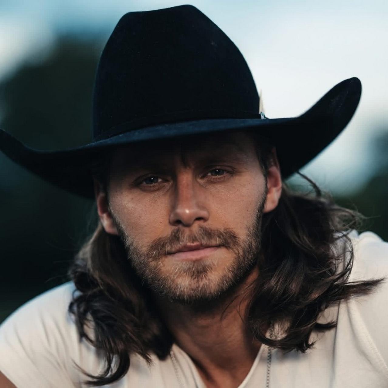 Warren head shot with a cowboy hat on