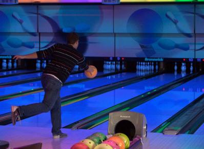 Throwing a bowling ball down the lane