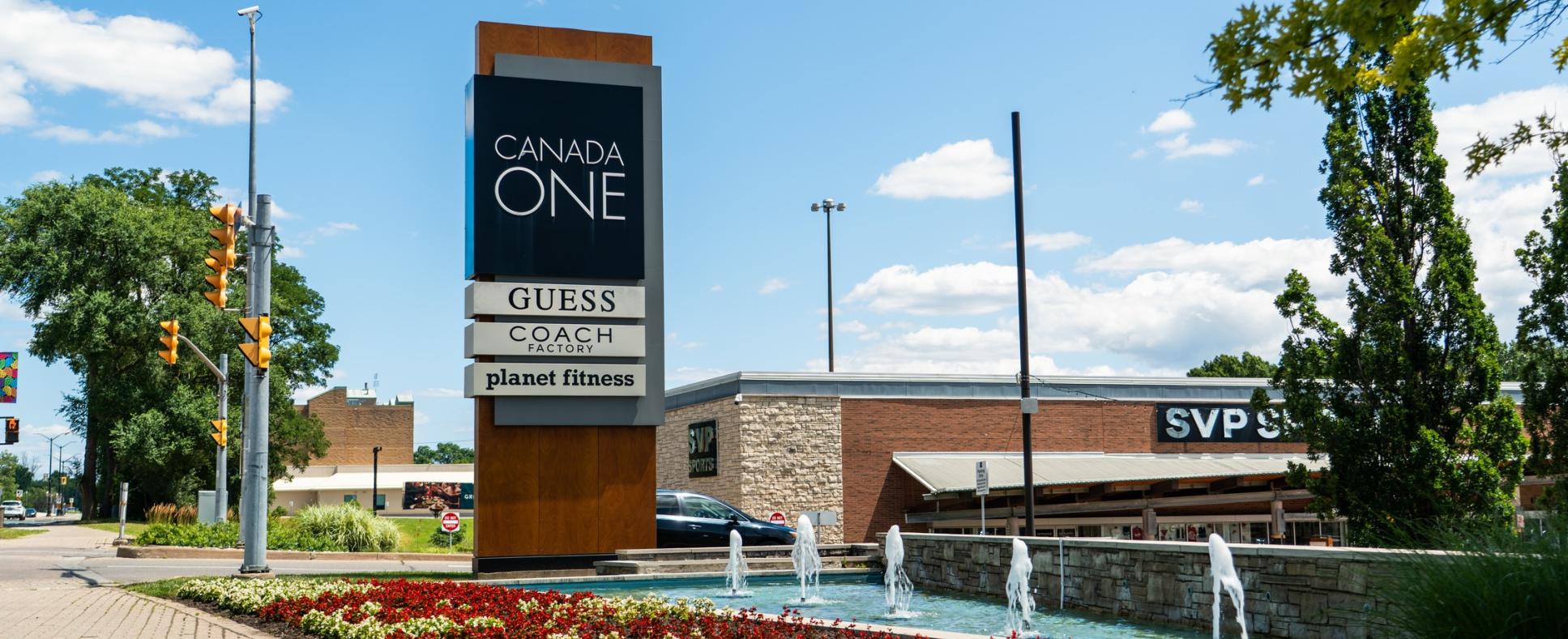 Canada One Outlet on Lundys Lane featuring fountain, SVP, COACH, and Guess