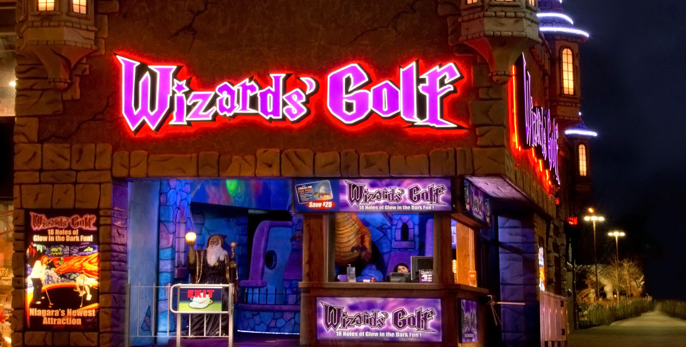 Exterior of Wizards Golf lit up at night